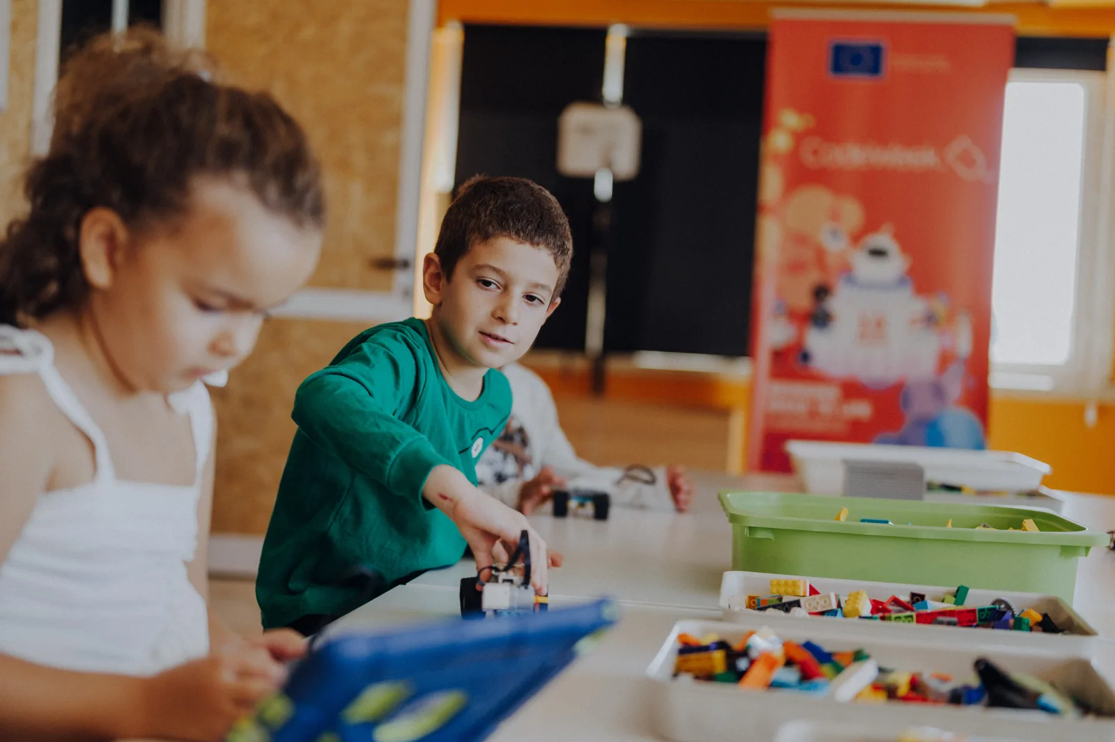 A child exploring a model at MasterKids